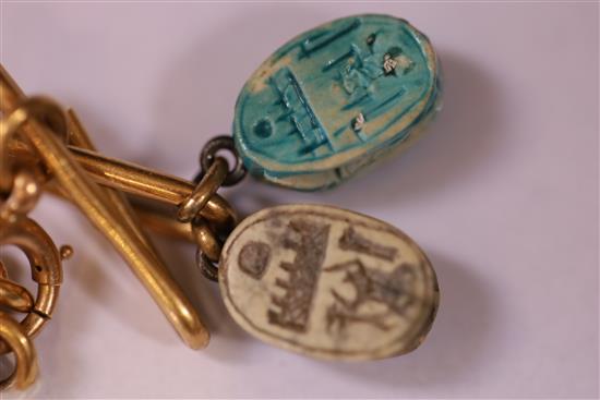 An 18ct bracelet, hung with five assorted charms, gross 33 grams.